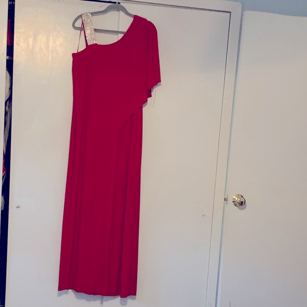 Wide legged red jumpsuit. Rhinestone shoulder strap. Looks like a gown. Size 16